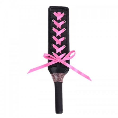 pu leren paddel met roze strikjes
