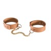 Handboeien of voetboeien bruin bondage bdsm